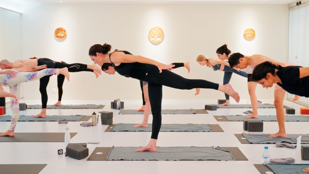 Conditioning class at Yoga Flame focused on strength, endurance and controlled movement.
