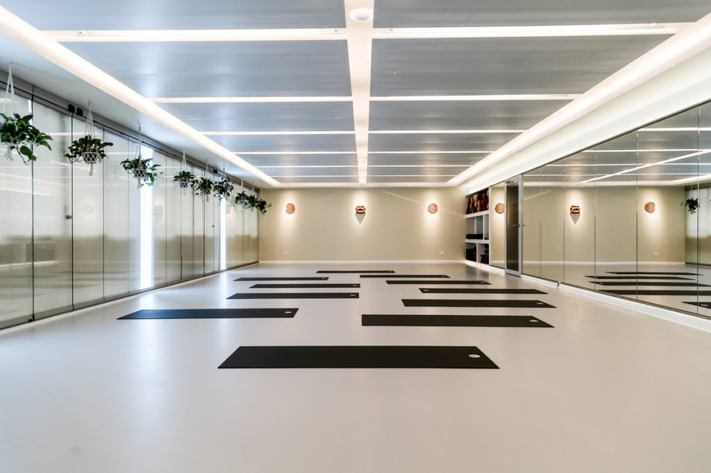 Team-building yoga practices designed to support connection, movement and wellbeing at work.
