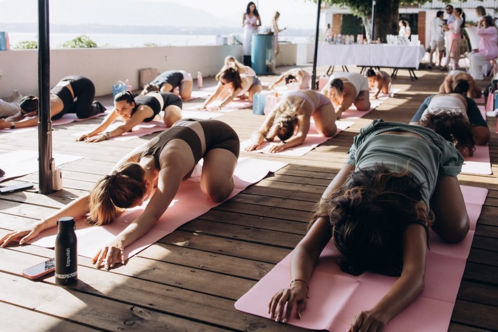 Team-building yoga practices designed to support connection, movement and wellbeing at work.