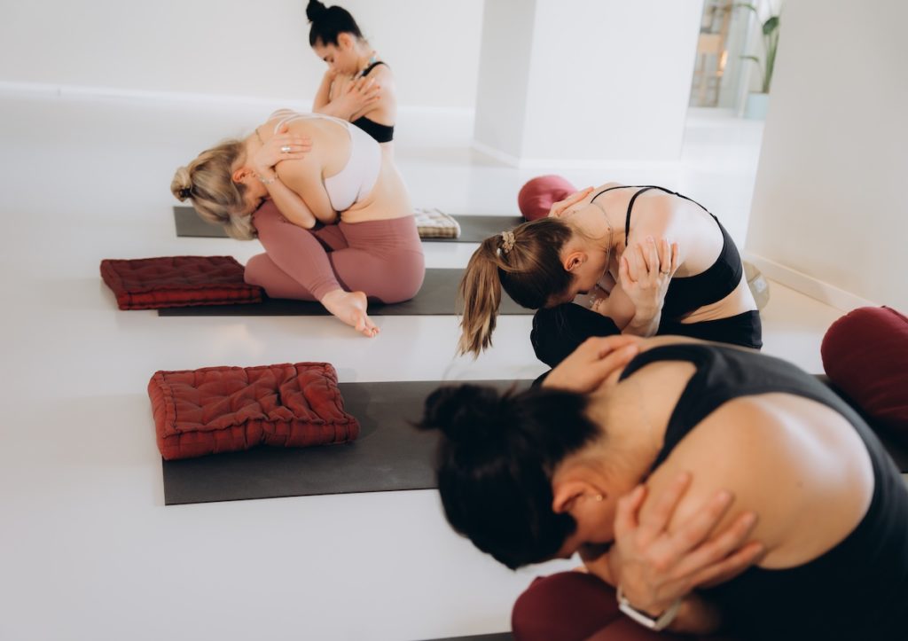 Non-heated grounding yoga class at Yoga Flame focused on mindful movement, breath and relaxation